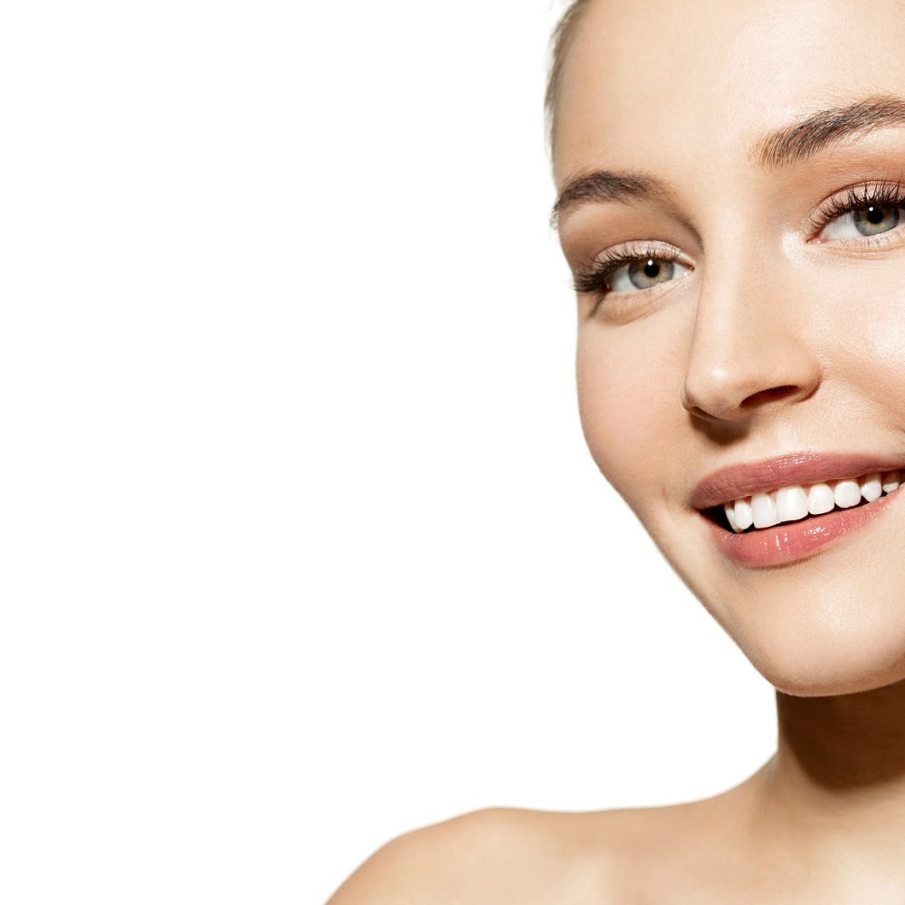 Portrait,Of,Smiling,Happy,Girl,Applying,Face,Oil,And,Enjoying